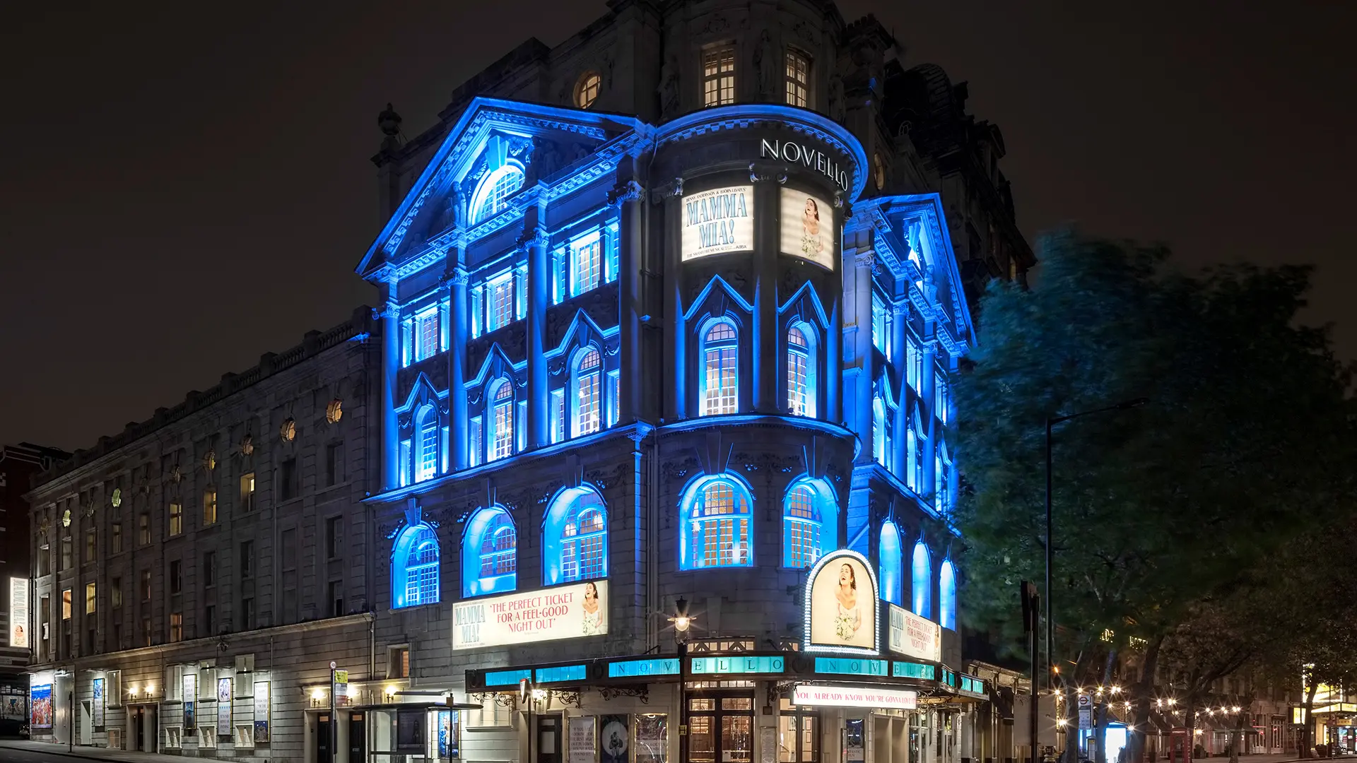 External view of Novello Theatre at night.
